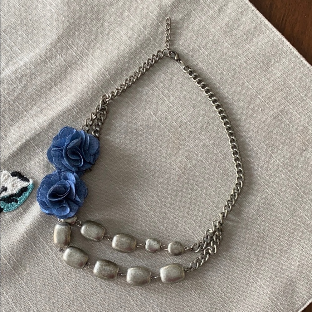 Pewter color necklace with blue flowers